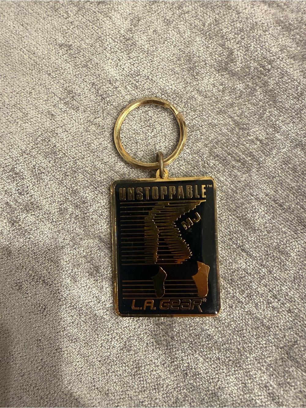 L.A. Gear Black and Gold 'Unstoppable' Rectangular Keychain